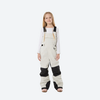 
                  
                    Kids breathable snowboard jacket and bib pants set - cream bib pants with black knee patches, kids on-model front view
                  
                