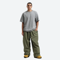 
                  
                    Men's waterproof 2L pullover snow jacket and pants - olive green snow pants, on-model front view, for resort and street wear
                  
                