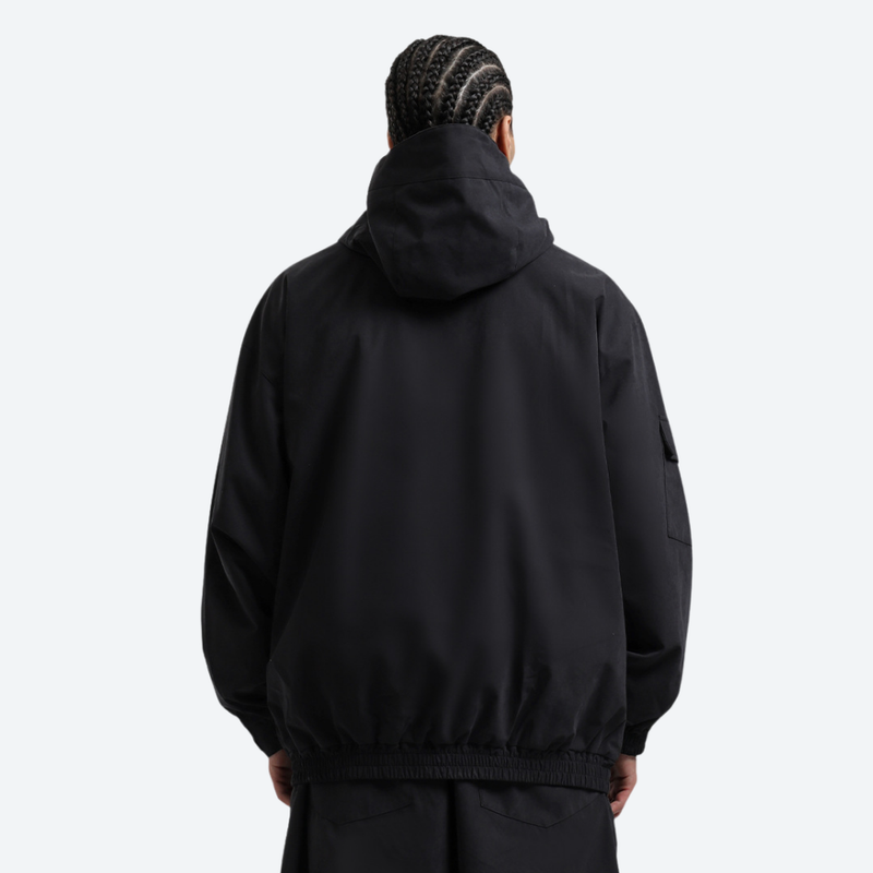 Unisex waterproof 3L snow anorak jacket and pants - black anorak jacket, on-model back view, for cold-weather winter sports