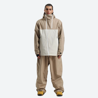 
                  
                    Men's breathable 2L snowboard jacket and pants - tan and white colorblock, on-model front view, for skiing and snowboarding
                  
                