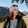 Soft merino wool knit hat for cold weather - pink letter print merino beanie on women with sunglasses, worn front view