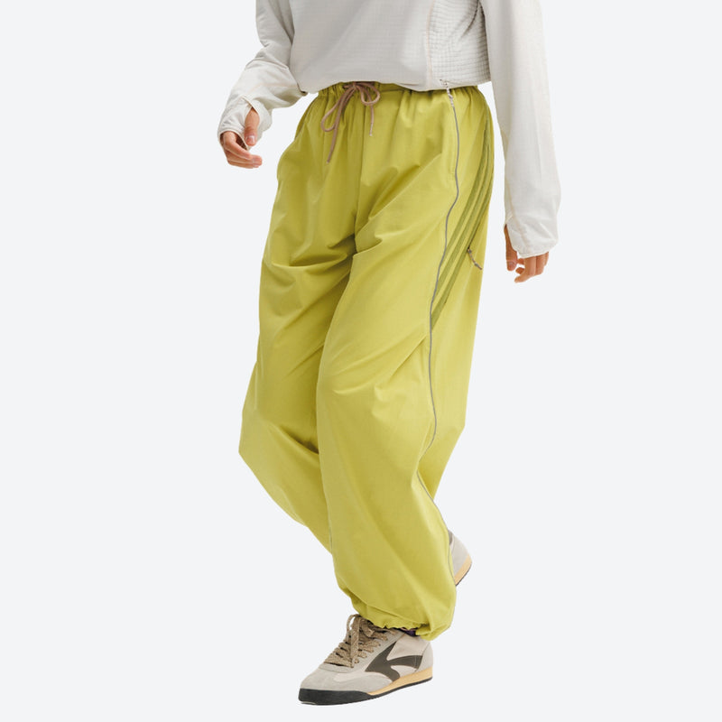 Breathable water-repellent trekking pants with vents - lime green pants with cream top, for camping and travel