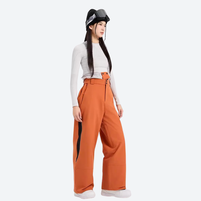 Women's colorblock snowboard jacket with wide-leg pants - orange wide-leg snow pants with white top, on-model side view