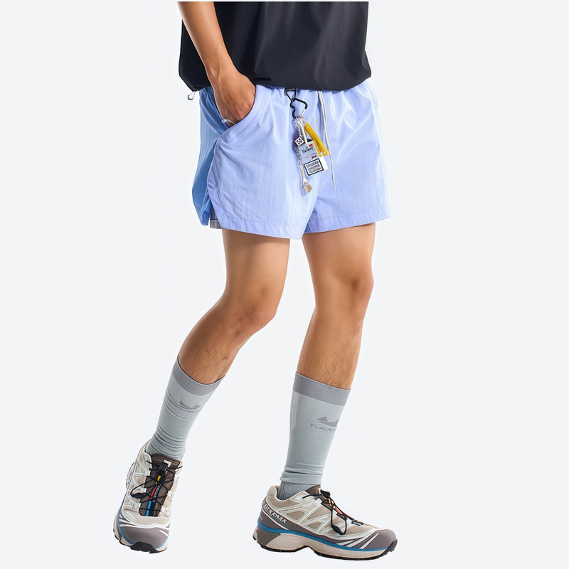 Lightweight water-repellent running shorts with liner - blue water-repellent shorts with black tee, for warm-weather training