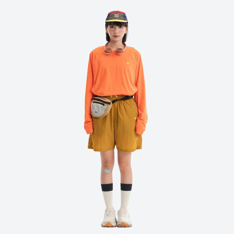 Lightweight trail shorts with back pocket - mustard yellow water-repellent shorts with orange top, for travel and city walks
