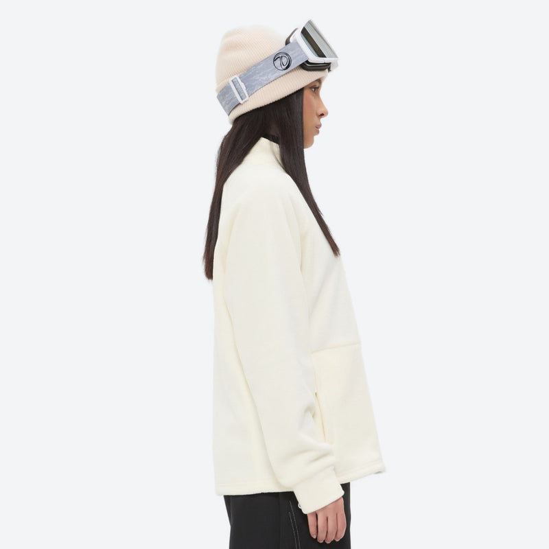 Lightweight high-warmth breathable fleece liner jacket - cream fleece liner jacket on women with beanie, side standing view