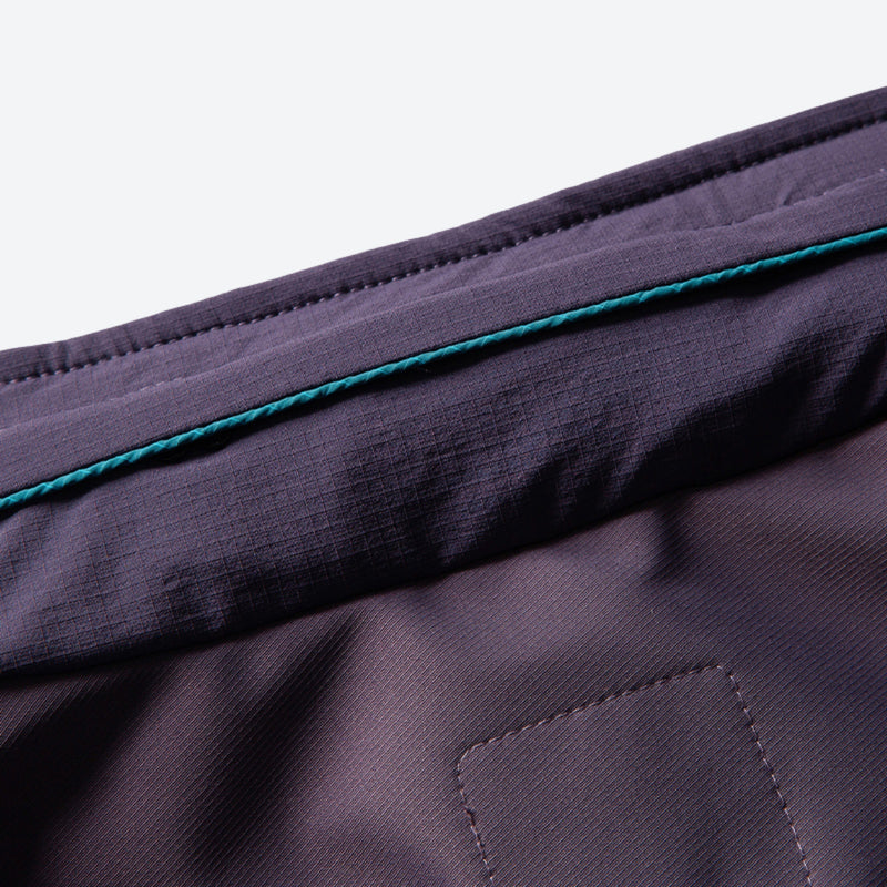 Unisex lightweight softshell outdoor pants - purple, seam piping close-up detail, for cold-weather outdoor wear