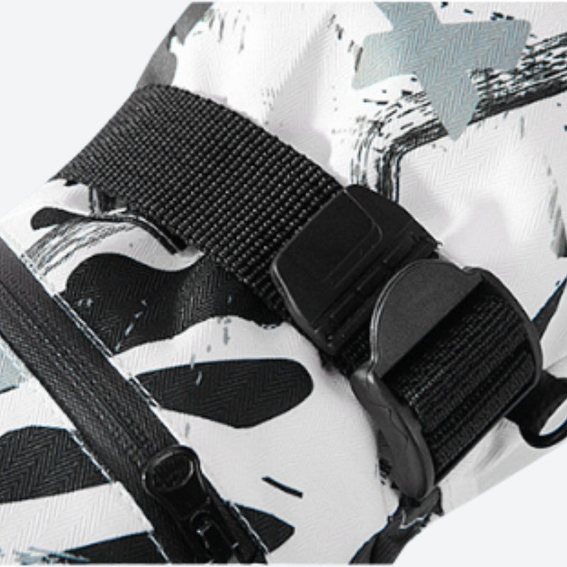 Snow gloves with card pocket and pair clip - white print snow glove strap, buckle strap close-up, for resort ski days