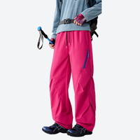 
                  
                    Breathable 650+ fill power duck down snow pants - pink down pants with blue top, for cold-weather winter sports
                  
                