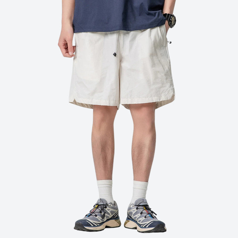 Breathable lightweight trail shorts - cream white quick-dry shorts with navy tee, for travel and city walks
