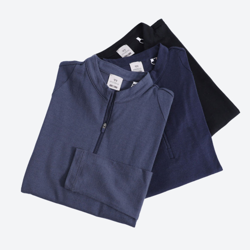 Women's soft merino wool baselayer with zip collar - blue navy and black merino wool half-zip top, folded stack product view