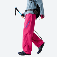 
                  
                    Unisex detachable liner insulated pants for winter - pink down pants with blue top and backpack, for skiing and snowboarding
                  
                