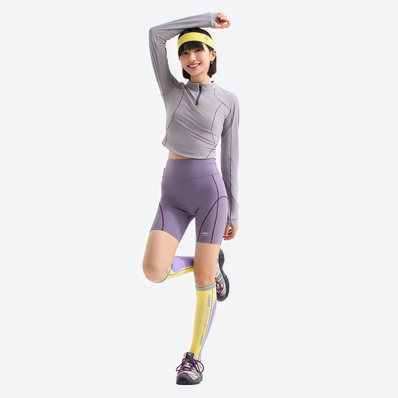 Women's wrinkle-resistant half-zip top - light gray half-zip long sleeve tee on women with headband, one-leg pose view