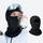 Breathable winter facemask worn with goggles - black facemask on women in white jacket with goggles and inset