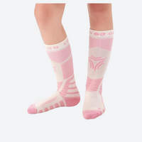 
                  
                    Kids breathable knee-high merino ski socks - pink kids compression merino ski socks on feet, for snow play and winter commute
                  
                