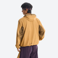 
                  
                    Packable hooded sun jacket for outdoor - ginger yellow sun jacket on men, back standing view, for travel and city walks
                  
                