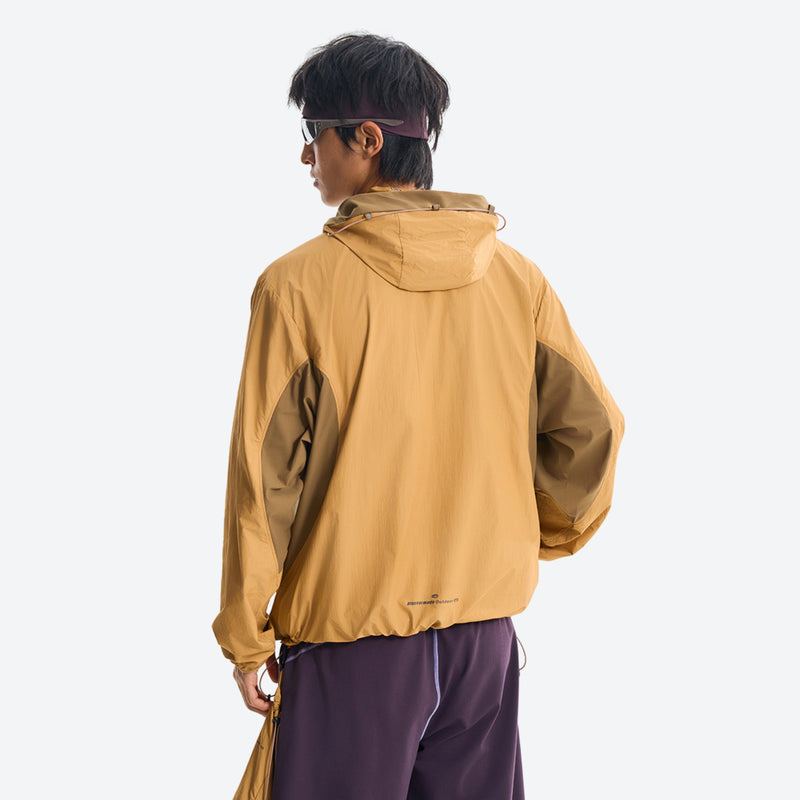 Packable hooded sun jacket for outdoor - ginger yellow sun jacket on men, back standing view, for travel and city walks