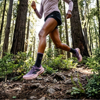 
                  
                    Women's moisture-wicking merino wool socks for trail - black pink merino wool hiking socks on women, forest running view
                  
                