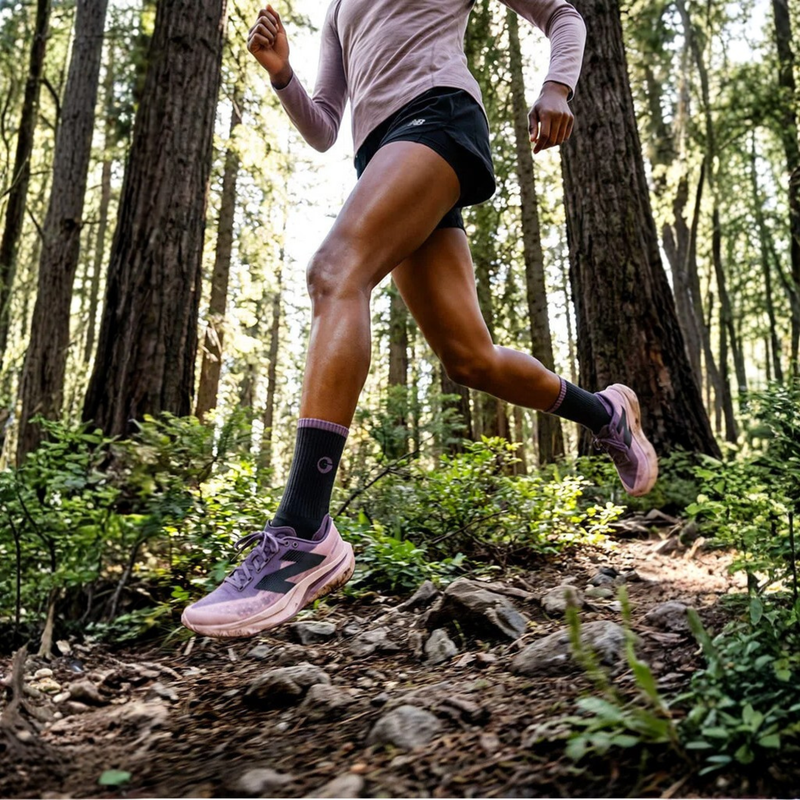 Women's moisture-wicking merino wool socks for trail - black pink merino wool hiking socks on women, forest running view
