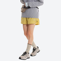 
                  
                    Unisex quick-dry running shorts - yellow running shorts with gray top, for warm-weather training
                  
                