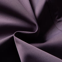 
                  
                    Unisex waterproof softshell jacket and cargo pants - purple, fabric texture close-up detail, for cold-weather outdoor wear
                  
                