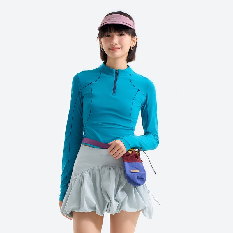 Women's wrinkle-resistant half-zip top - lake blue half-zip long sleeve tee on women with cap, for hiking and trail walking