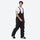 Unisex snowboard jacket and bibs set - black bib pants, on-model walking three-quarter view, for skiing and snowboarding