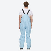 
                  
                    Unisex waterproof 2L snow jacket and bib pants - ice blue bib pants, on-model back view, for powder and piste riding
                  
                
