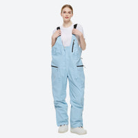 
                  
                    Unisex waterproof 2L snow jacket and bib pants - ice blue bib pants, on-model front view, for powder and piste riding
                  
                