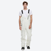 
                  
                    Unisex waterproof 2L snow jacket and bib pants - white bib pants, on-model front view, for skiing and snowboarding
                  
                