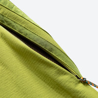 
                  
                    Breathable water-repellent trekking pants with vents - lime green, thigh zip vent close-up detail, for hiking and trekking
                  
                