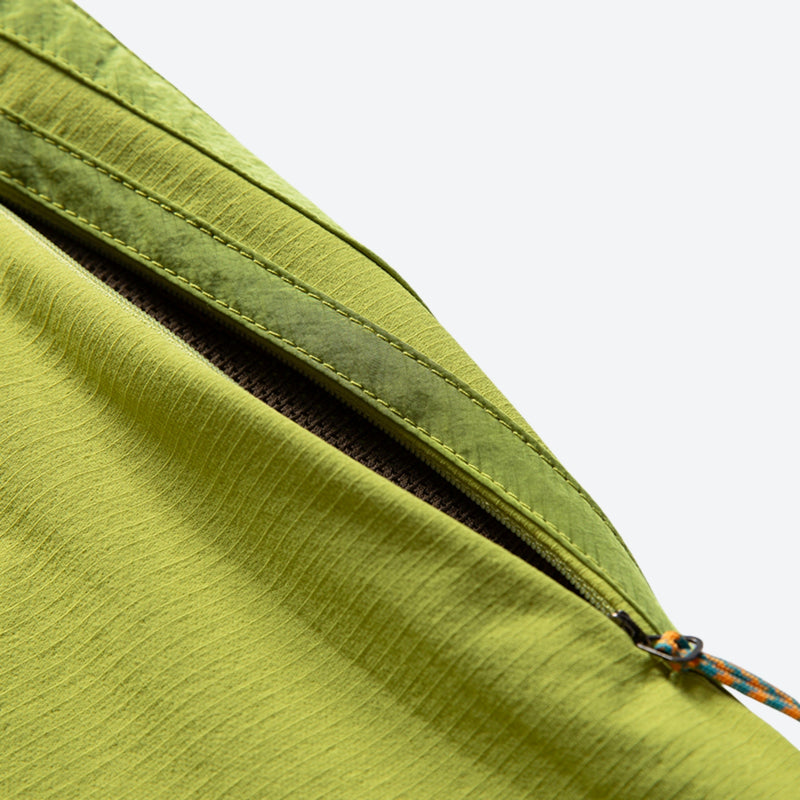 Breathable water-repellent trekking pants with vents - lime green, thigh zip vent close-up detail, for hiking and trekking