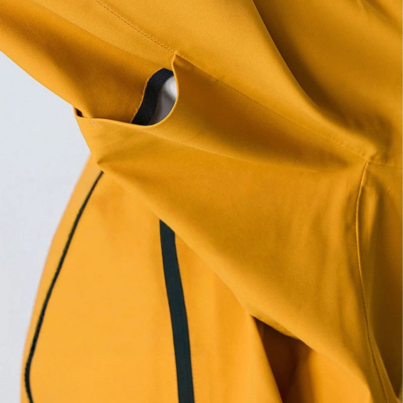 Unisex packable snowboard rain jacket with vents - mustard, underarm vent close-up detail, for cold-weather outdoor wear