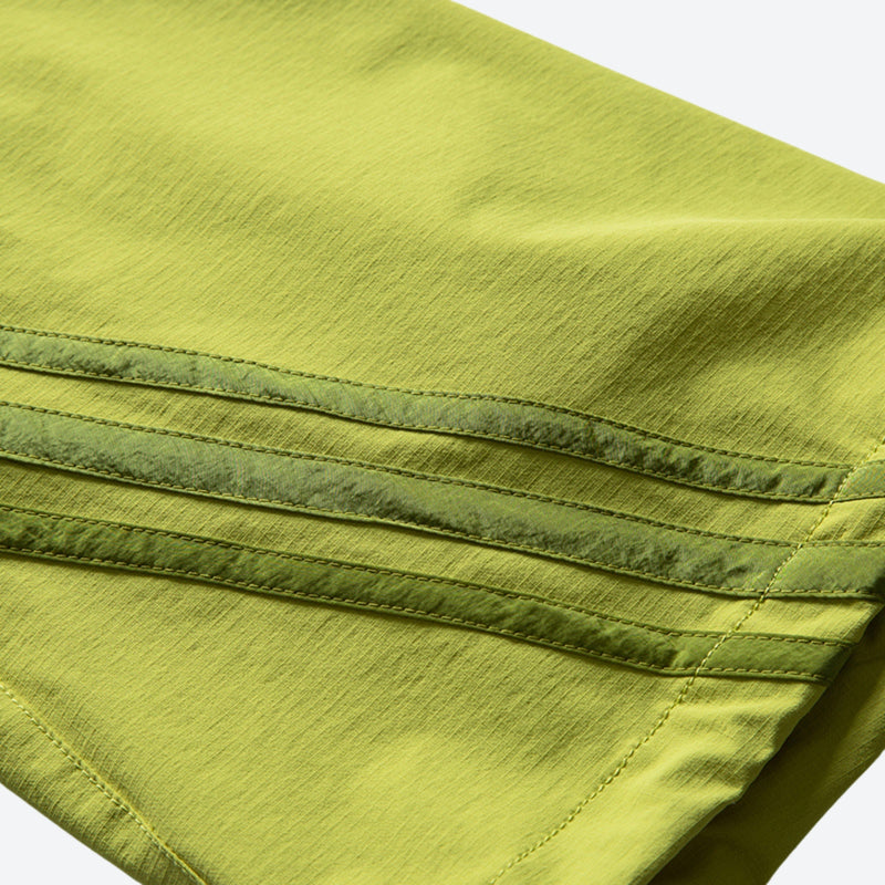 Unisex lightweight outdoor cargo pants - lime green, seam tape close-up detail, for trail and mountain walks
