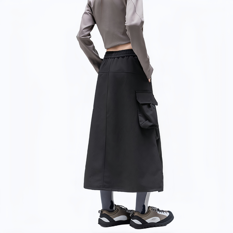 Cargo pocket outdoor long skirt for women - black cargo long skirt on women, back side view, for hiking and trail walking