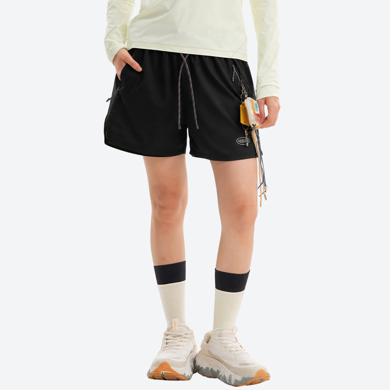 Water-repellent running shorts with drawcord waist - black running shorts with cream top, for hiking and trail walking