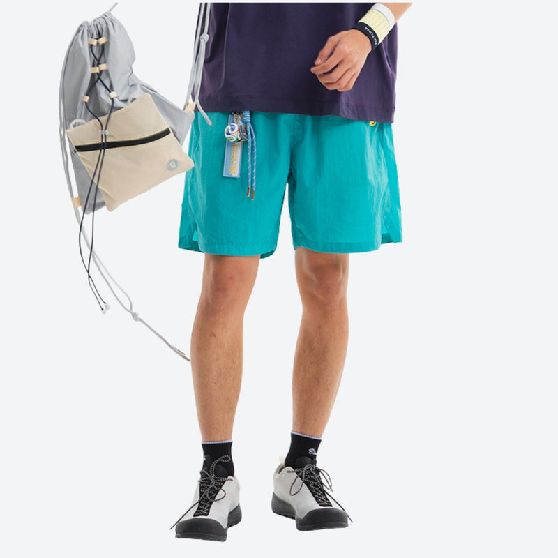 Breathable water-repellent shorts for outdoor - teal water-repellent shorts with purple tee, for hiking and trail walking