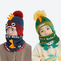 
                  
                    Knitted kids beanie facemask combo for snow days - dinosaur print kids beanie with facemask on two kids, worn pair view
                  
                