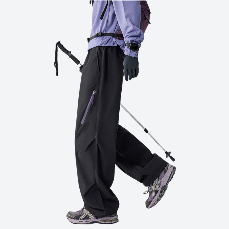 Unisex detachable liner insulated pants for winter - black down pants, side walking view, for winter commute and travel