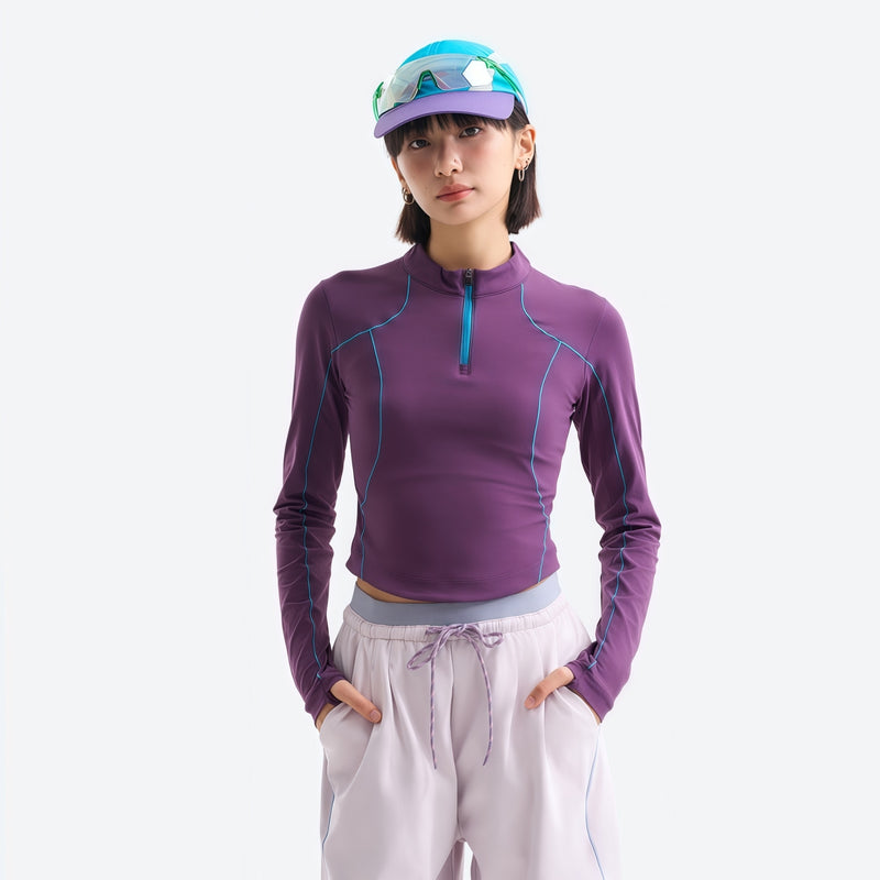 Women's wrinkle-resistant half-zip top - purple half-zip long sleeve tee on women with cap, for hiking and trail walking