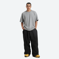 
                  
                    Men's breathable ski jacket with chest zip pockets - black snow pants with gray tee, for resort and street wear
                  
                