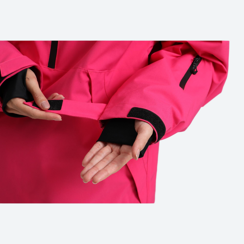 Women's 2-layer snowboard jacket and pants - rose pink, cuff opening close-up with hand, for skiing and snowboarding