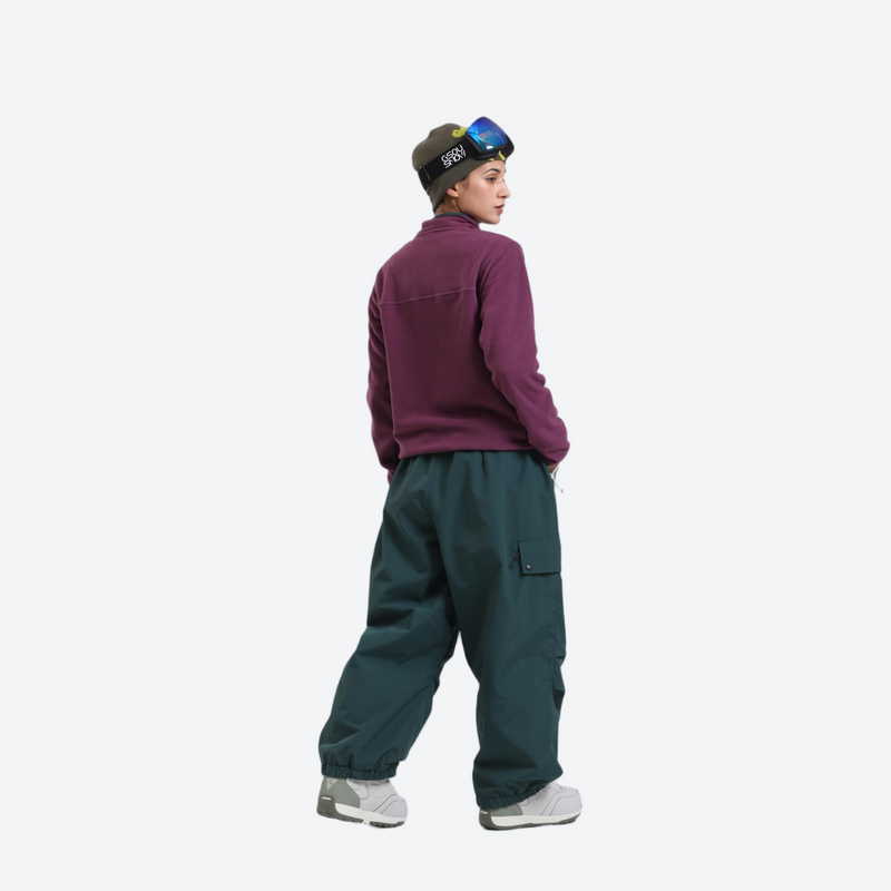 Waterproof 3L cargo snow pants - dark green snow pants with purple pullover, on-model side view, for resort and street wear