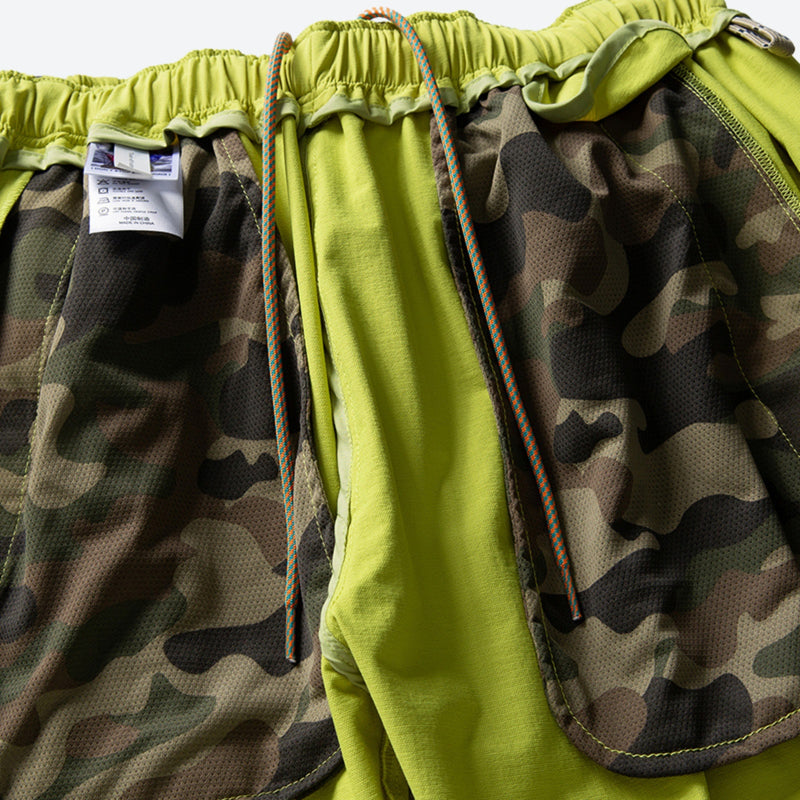 Unisex lightweight outdoor cargo pants - lime green, interior camo lining close-up detail, for hiking and trekking
