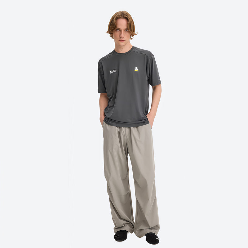 Water-repellent cargo hiking pants with drawcord hem - light gray wide-leg cargo pants with gray tee