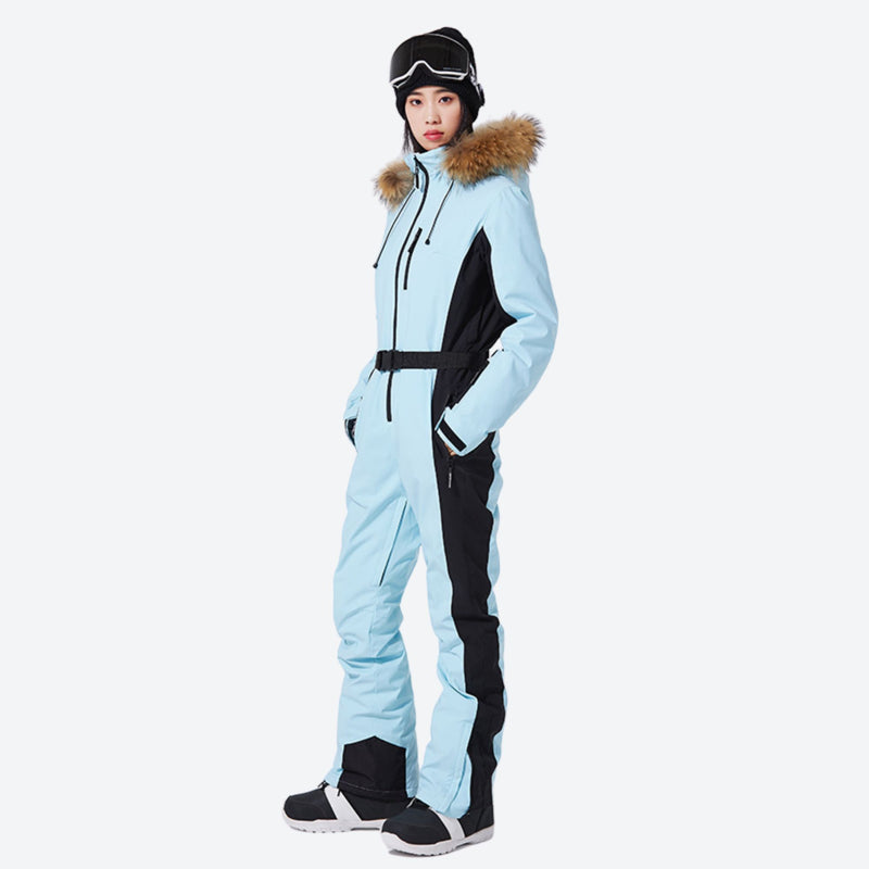 Women's waterproof 3L one-piece snow suit - ice blue one-piece snow suit, on-model side view, for cold-weather winter sports