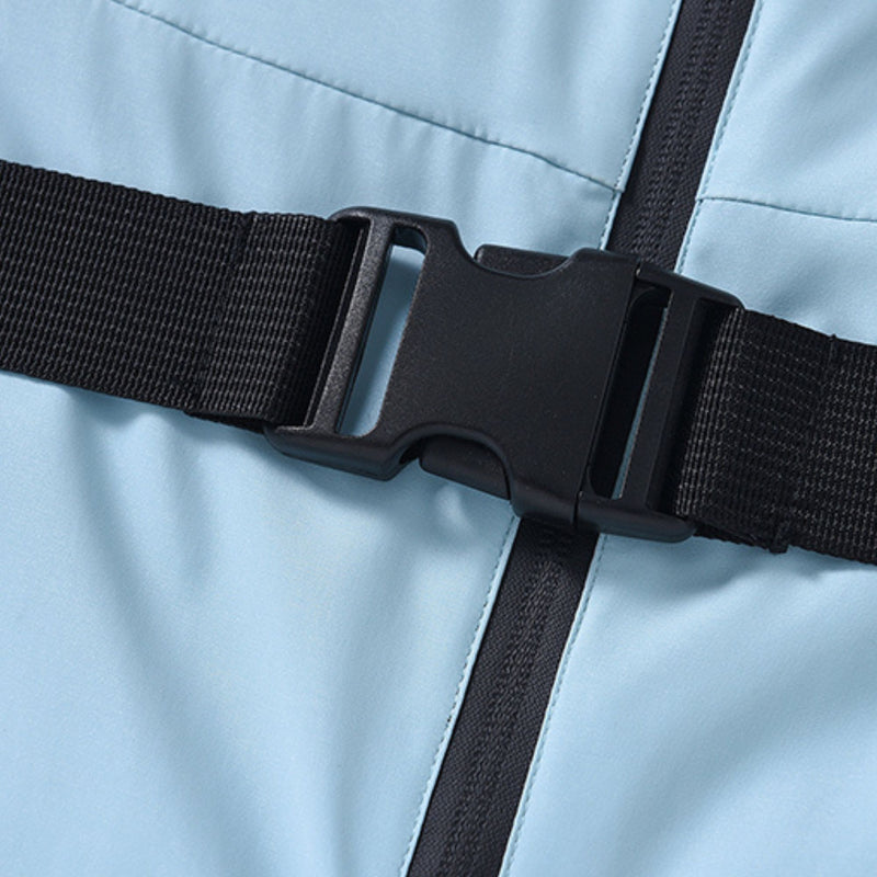 Women's waterproof 3L one-piece snow suit - ice blue, waist belt buckle close-up detail, for resort and backcountry days