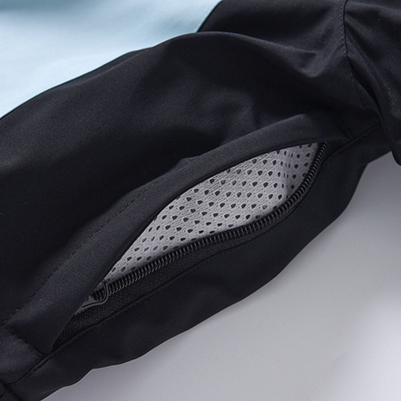 Women's one-piece snowboard suit with waist belt - black, pocket mesh interior close-up detail, for skiing and snowboarding