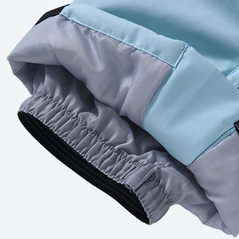 Women's one-piece snowboard suit with waist belt - ice blue, hem elastic close-up detail, for powder and piste riding