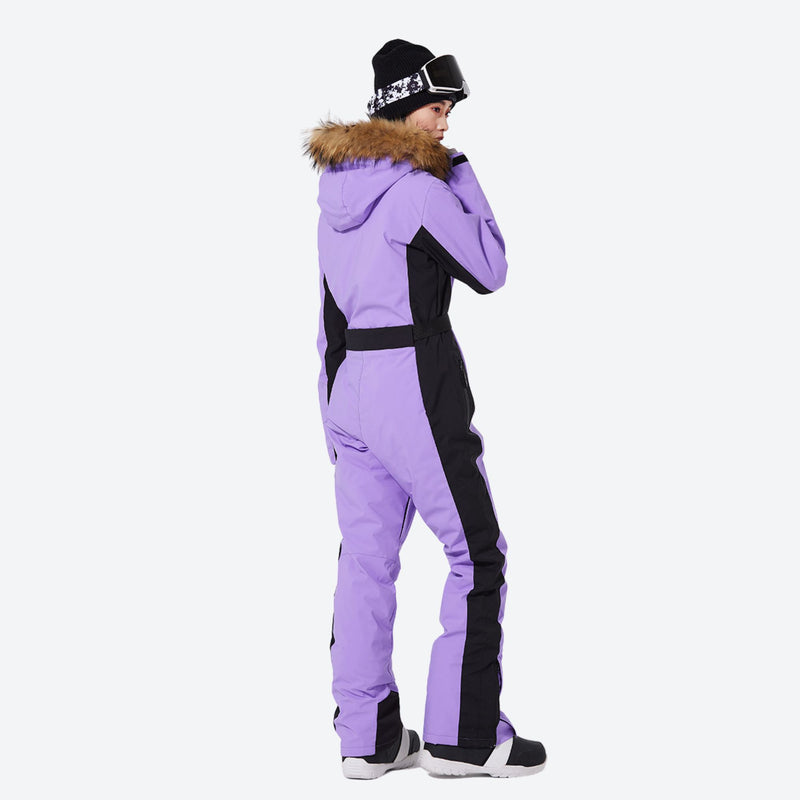 Women's waterproof 3L one-piece snow suit - purple one-piece snow suit, back three-quarter view, for powder and piste riding